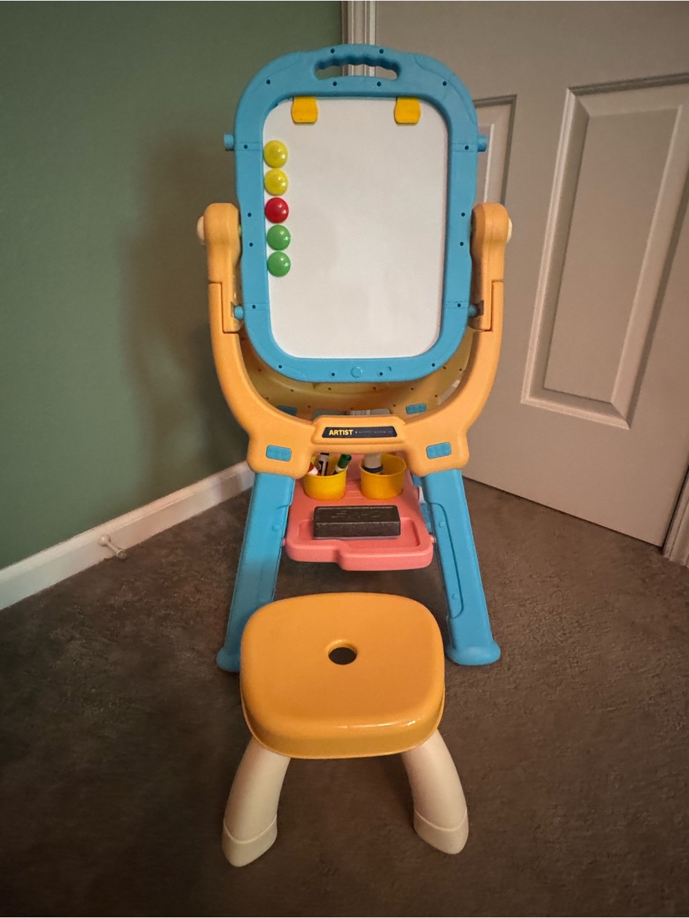 Art easel with dry erase magnetic side and chalk side